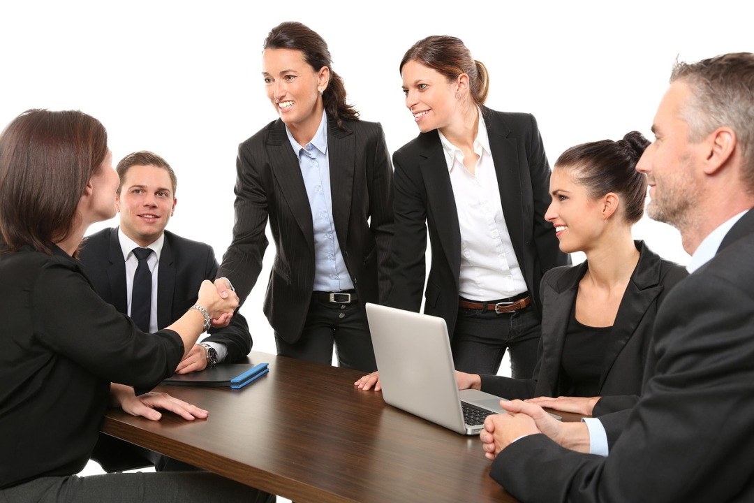NimbusHost team collaborating in office